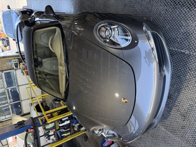 A Porsche 911 Carrera in the service bay at R&R Auto Systems.